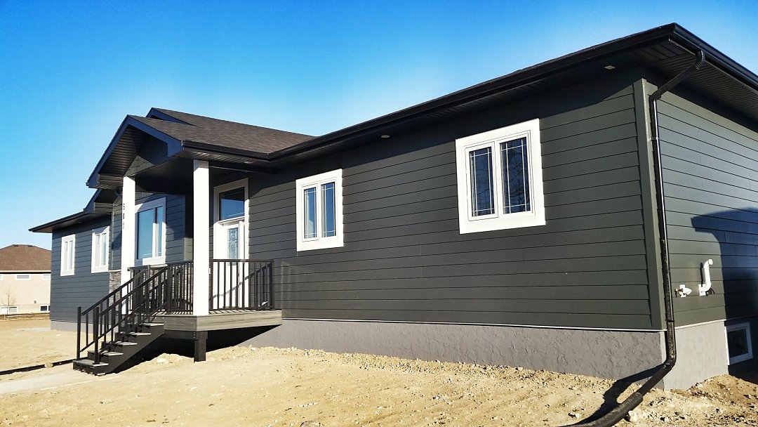 Fiber cement siding, stacked stone & acrylic parging